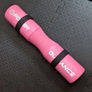 A bright pink barbell pad.