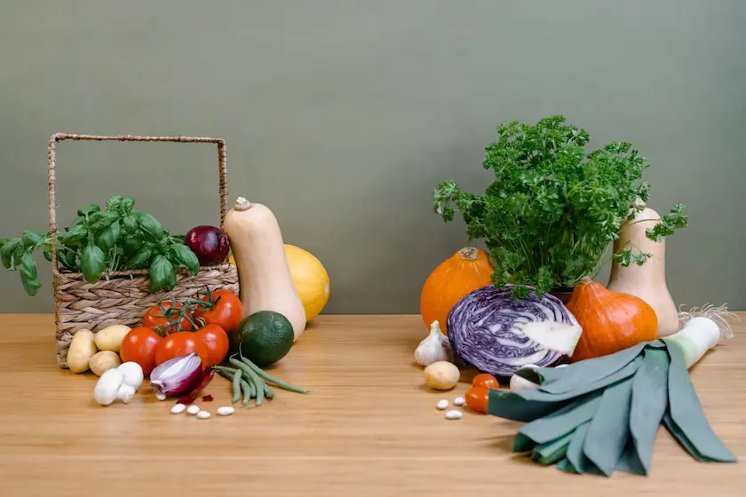 various fresh vegetables and herbs on a table