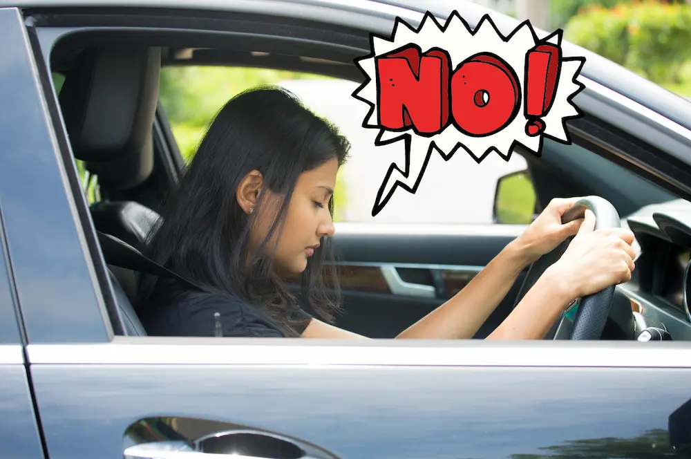 woman stuck in traffic going to the gym